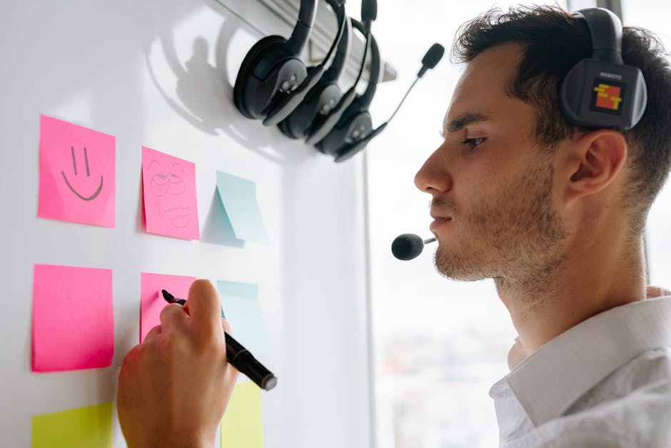 A person brainstorming with sticky notes on a whiteboard