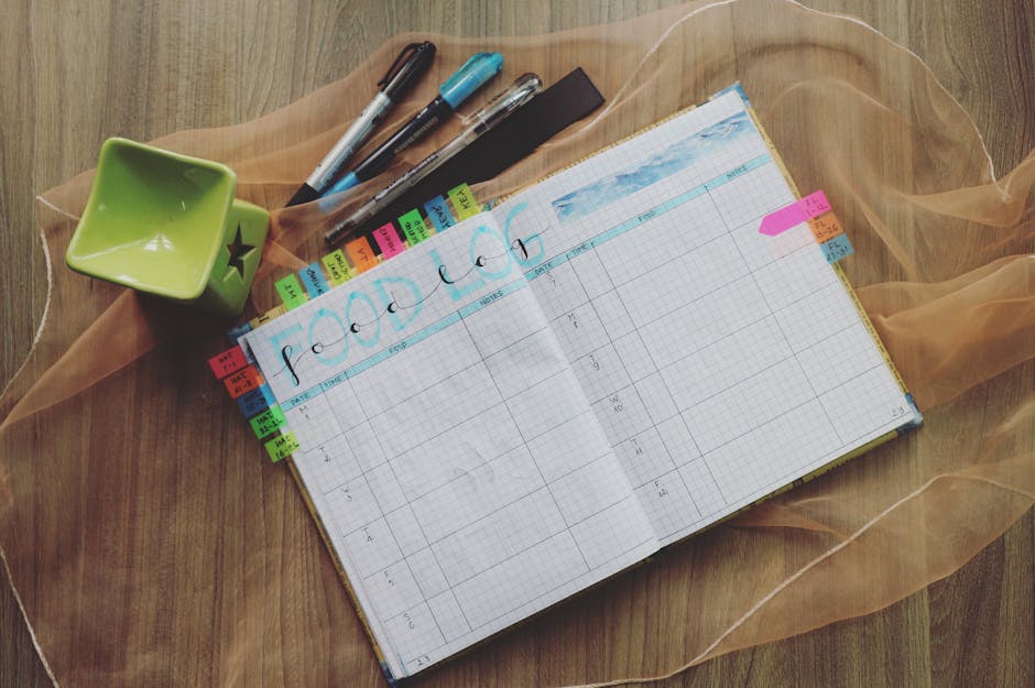 A notebook and planner open on a clean, organized desk