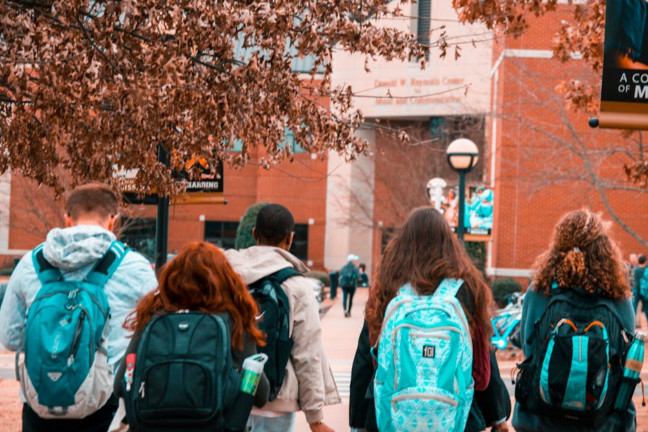 A student walking across campus with confidence on a bright morning